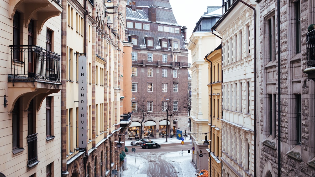 A modern Skatteverket service office building in a quiet, clean city street in Sweden.